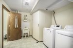 Ground level has a walk through laundry room that leads into the bathroom